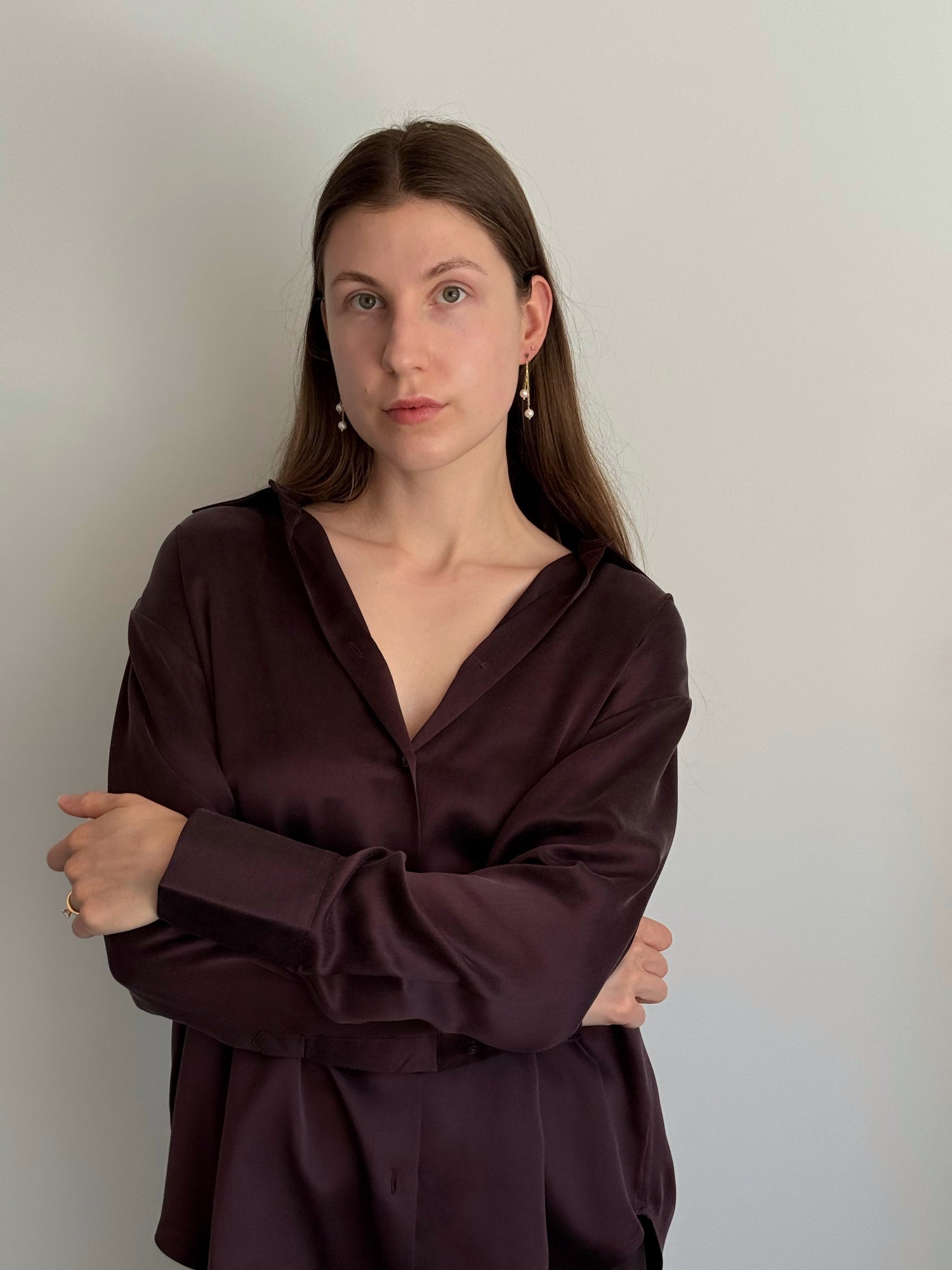 Model wearing heart stud pearl drop earrings