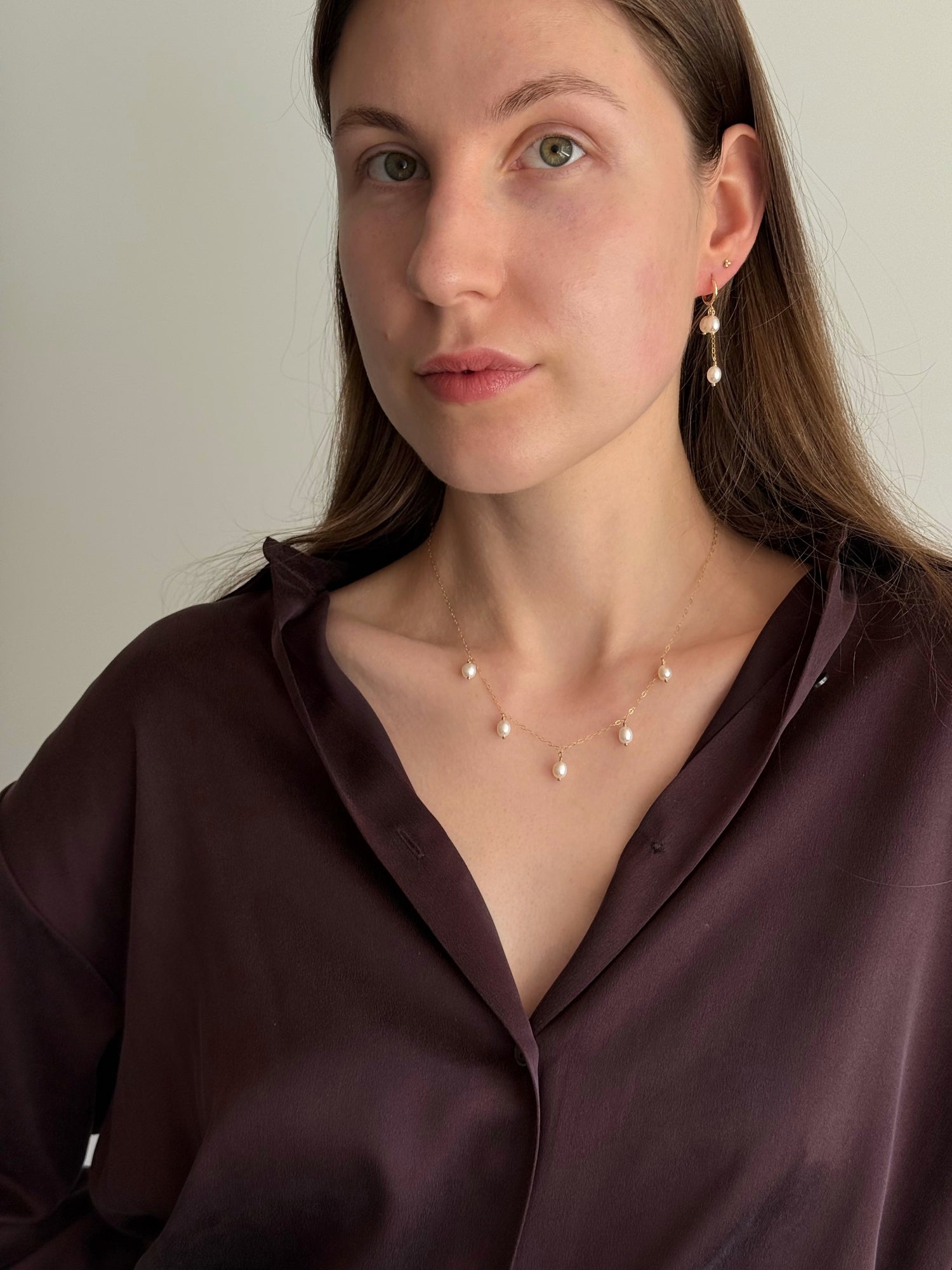 Gold-filled hoop earrings with two short pearls and one long drop