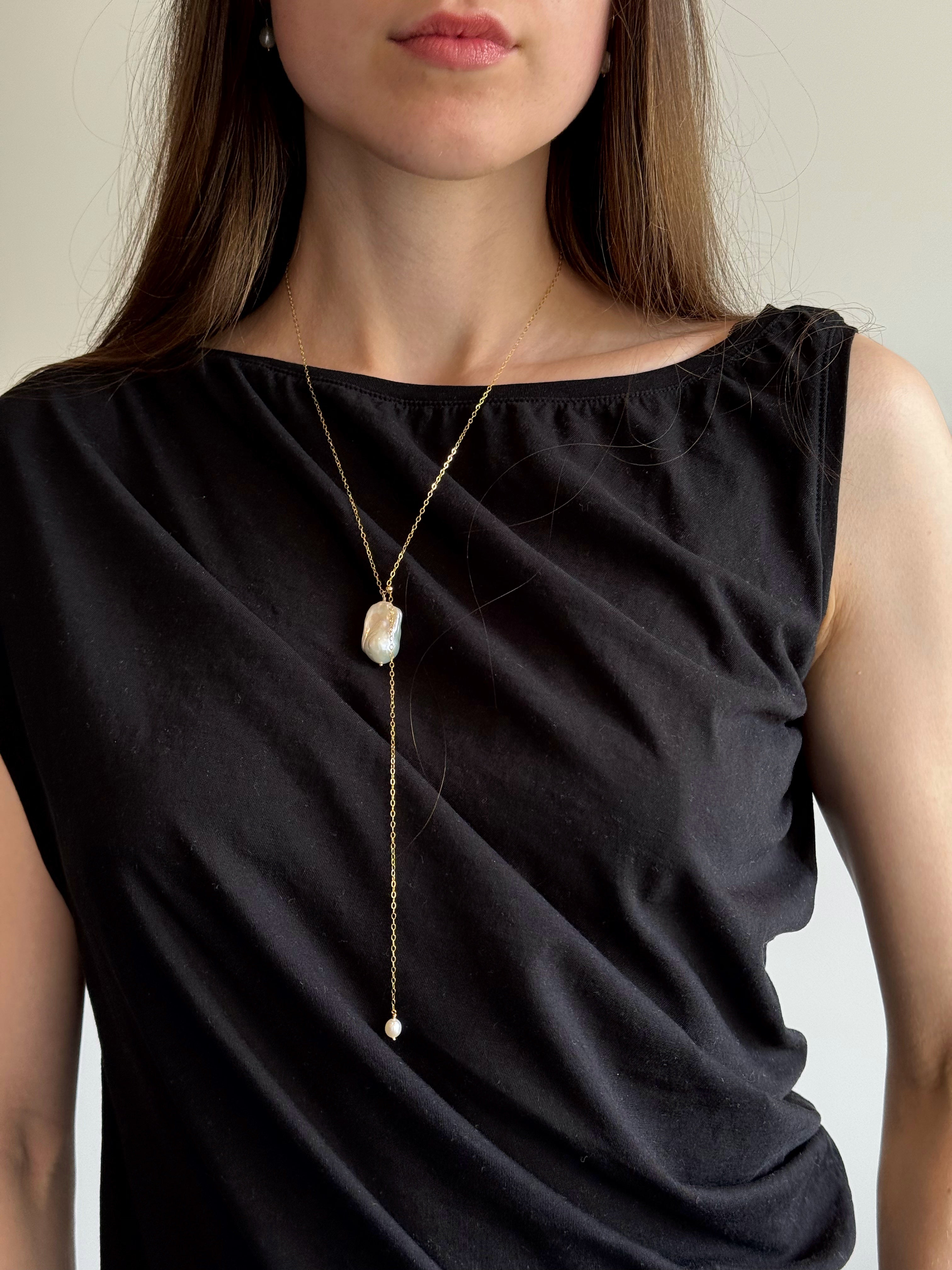 Close-up of freshwater baroque pearl on adjustable gold-filled chain