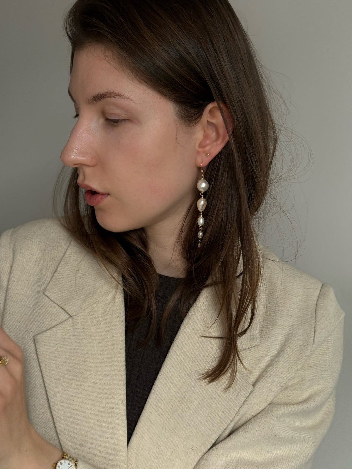 Graduating freshwater pearl drop earrings, 9cm, wire-wrapped in 14k gold-filled. Four pearls from 15mm to 5mm. Made to order in Wellington, New Zealand.