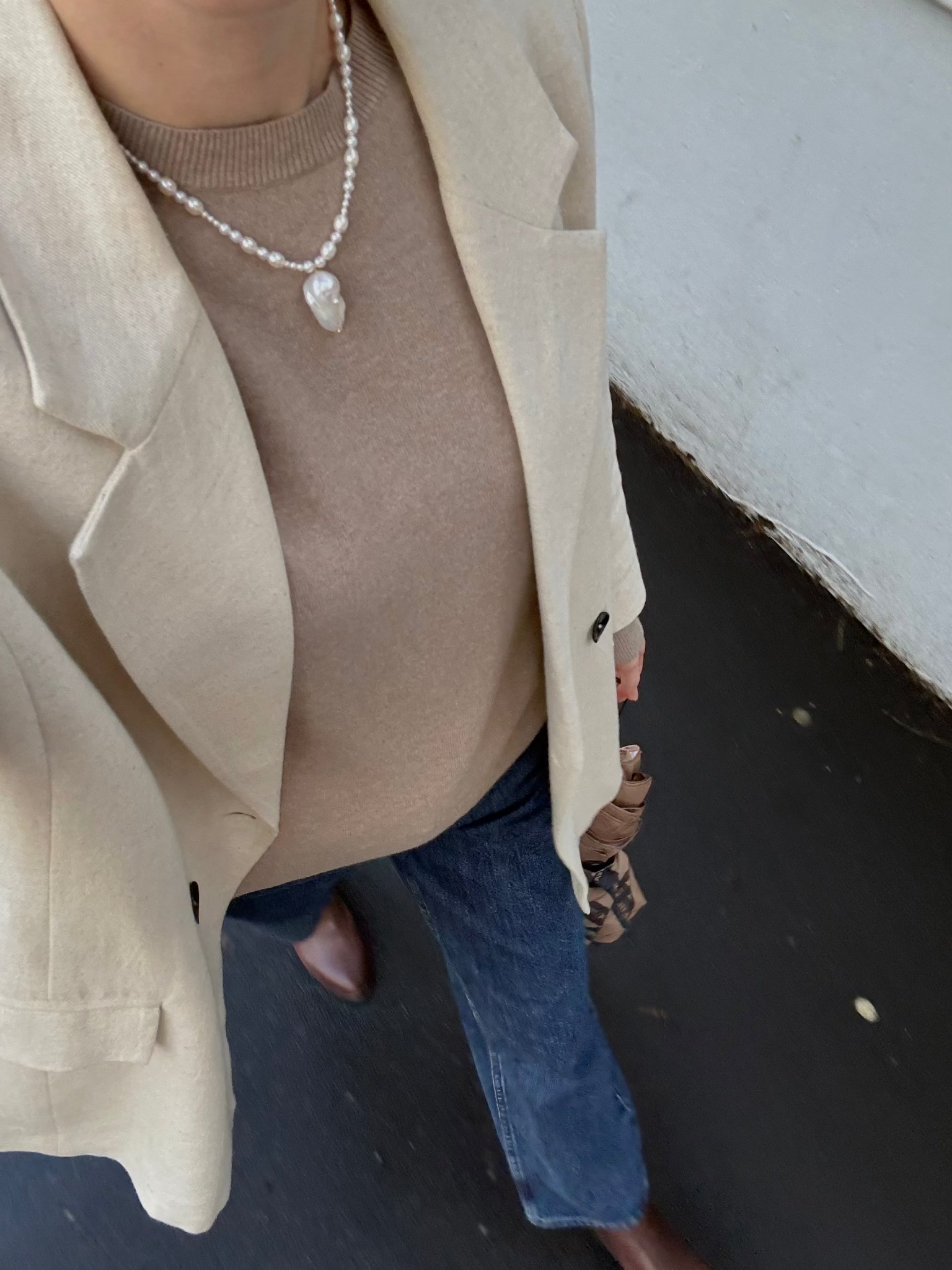 A graduated freshwater pearl necklace with a sculptural baroque pendant. 14k gold-filled findings, made to order in Wellington, New Zealand.