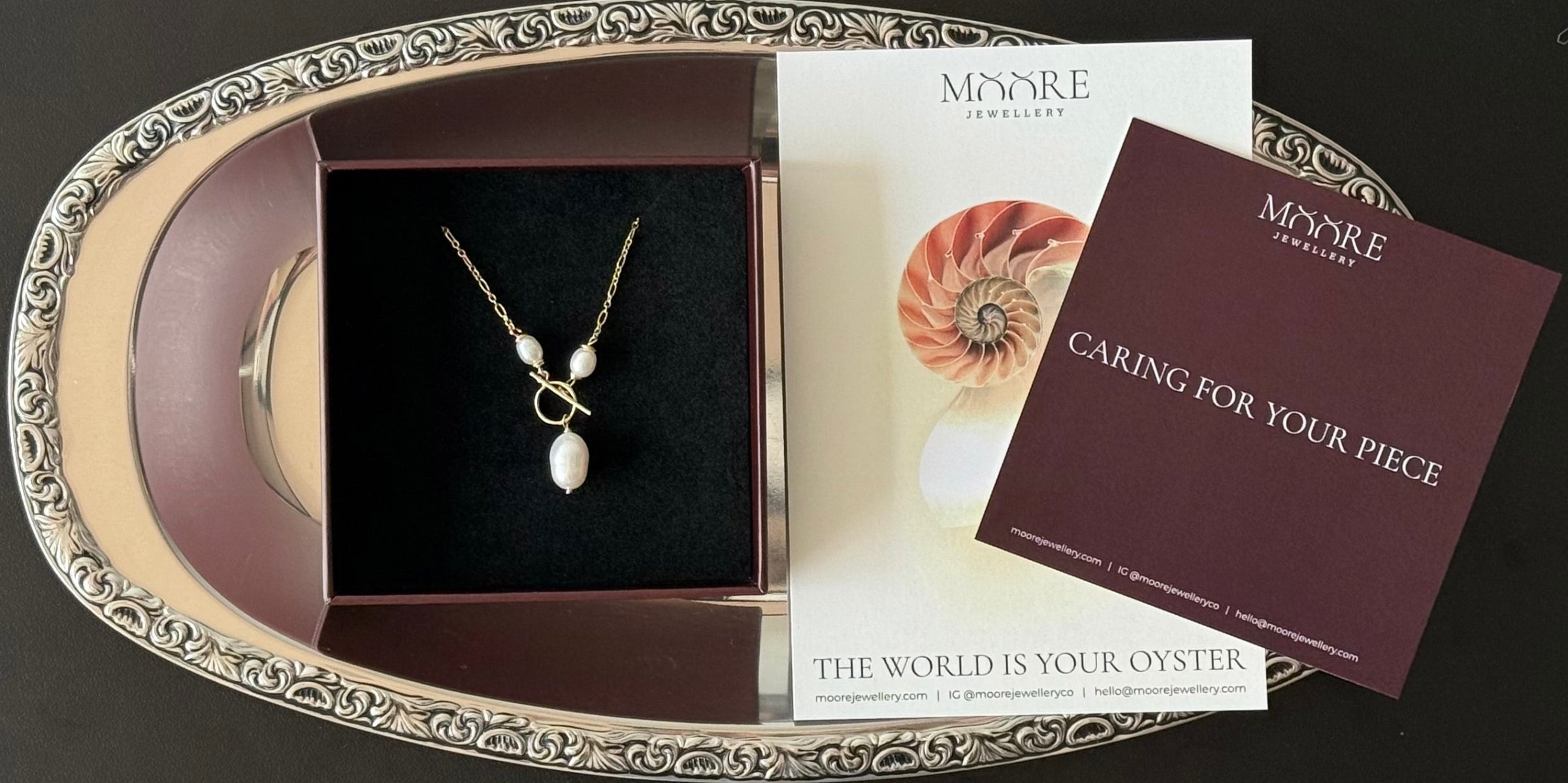 jewellery in a gift box with a thank you and care card 