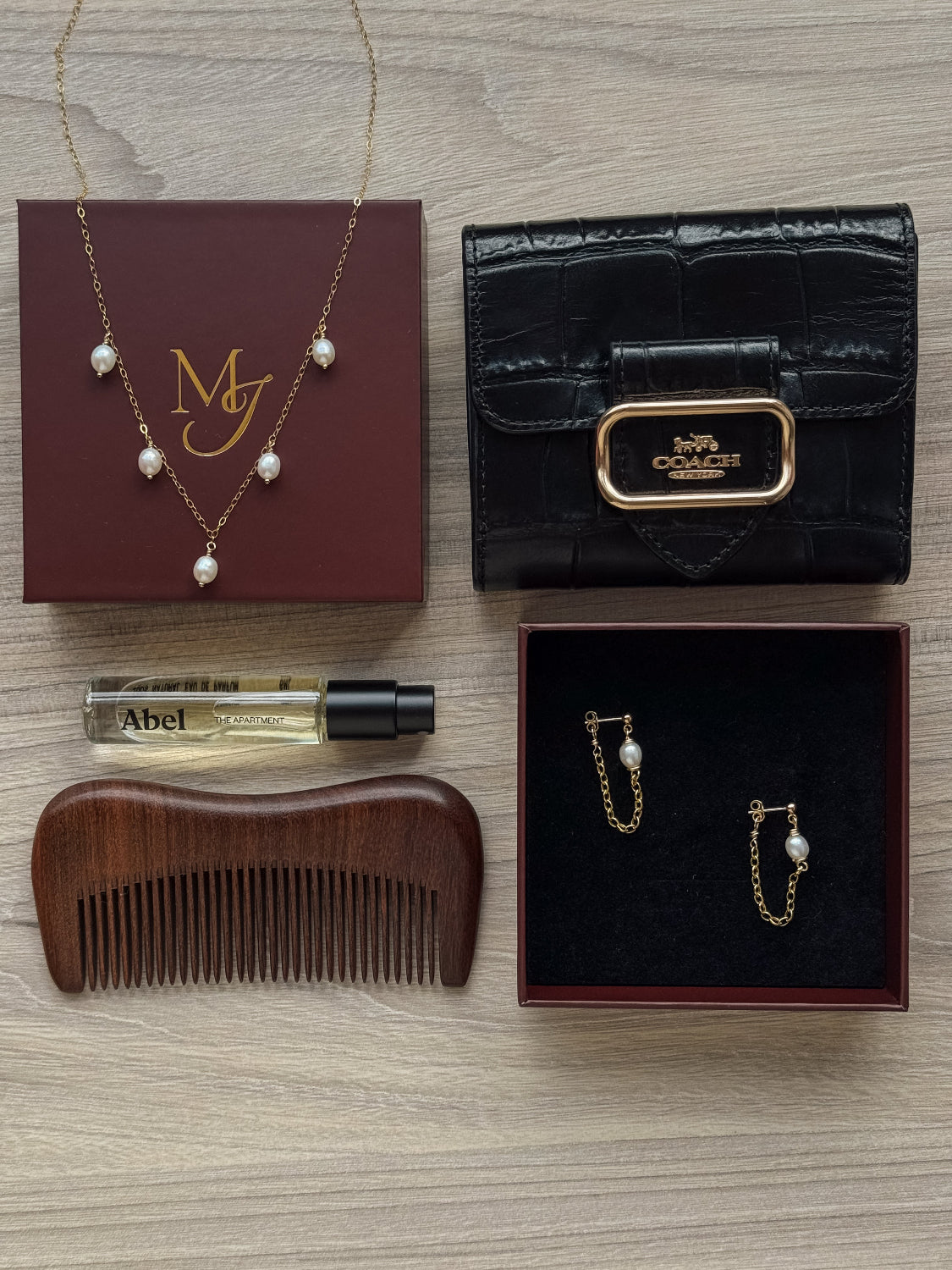 Close-up of evenly spaced oval pearls on delicate chain