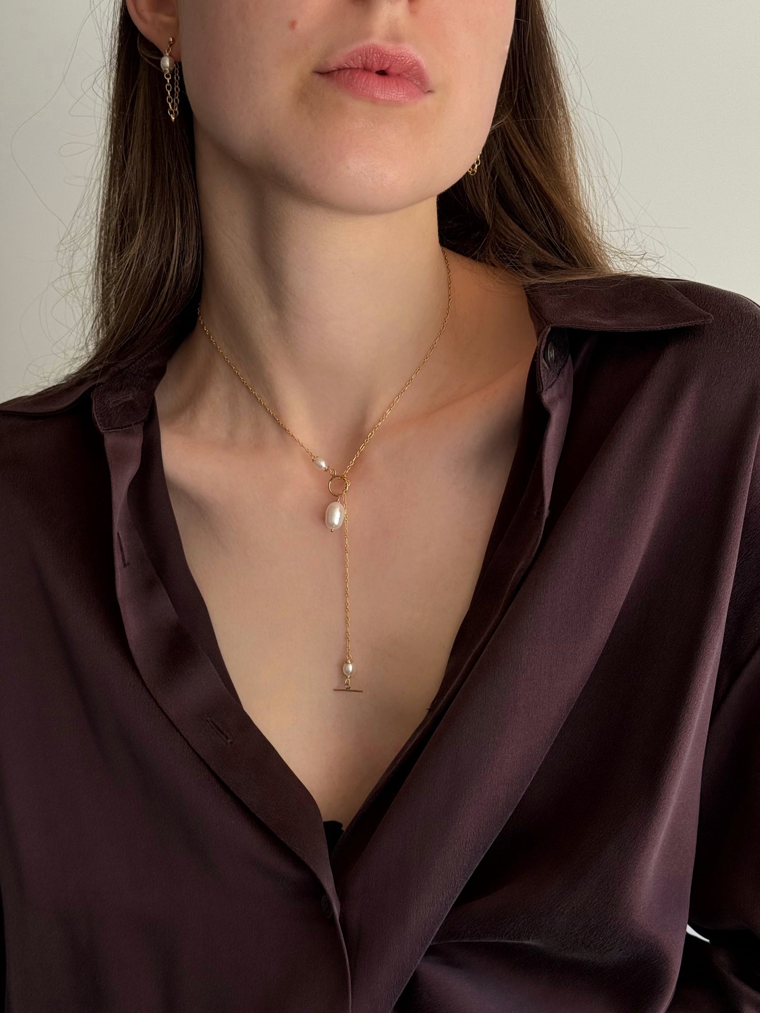 Freshwater pearl necklace styled as a lariat