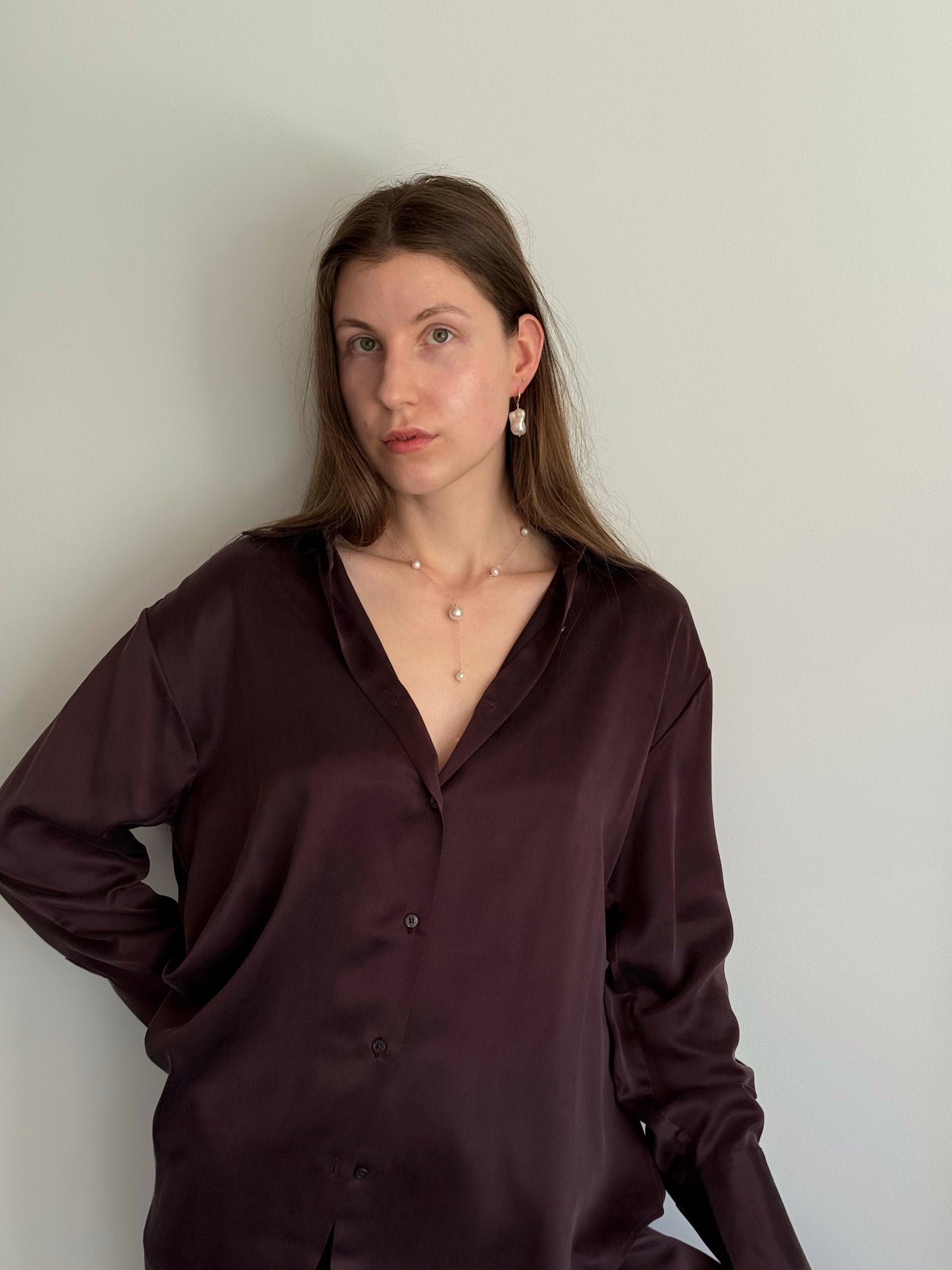 Handmade baroque pearl earrings shown on model