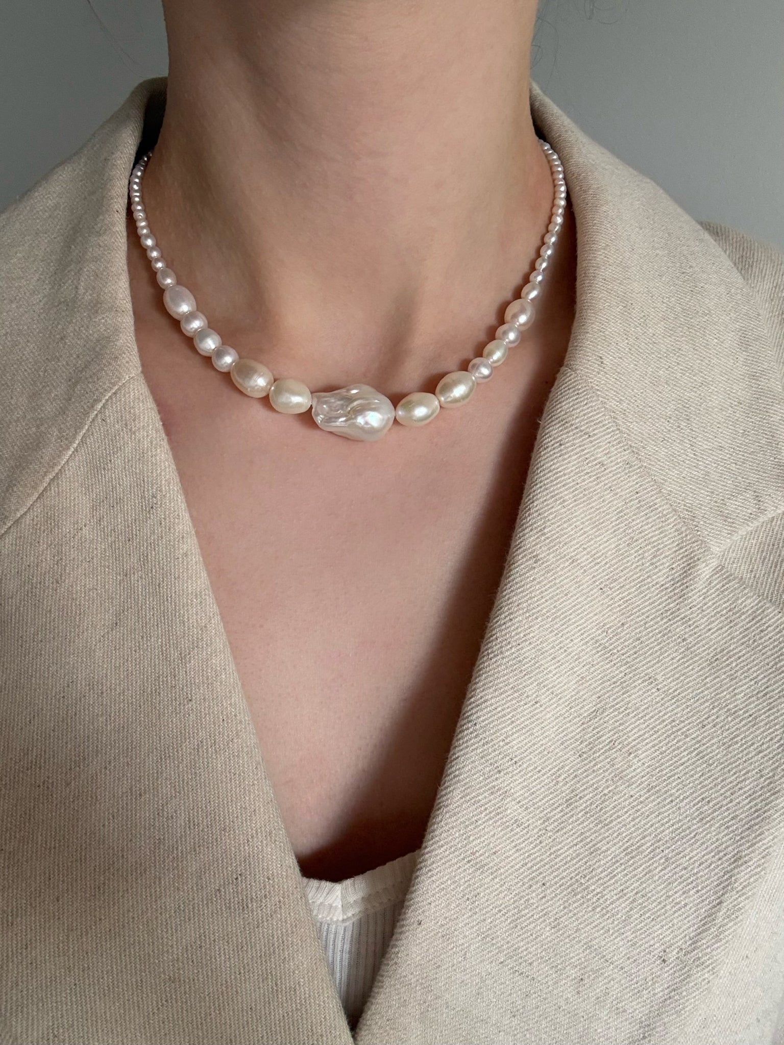 A graduating baroque freshwater pearl necklace with a large centre pearl and 14k gold-filled findings. Made to order in Wellington. 40cm + extension.