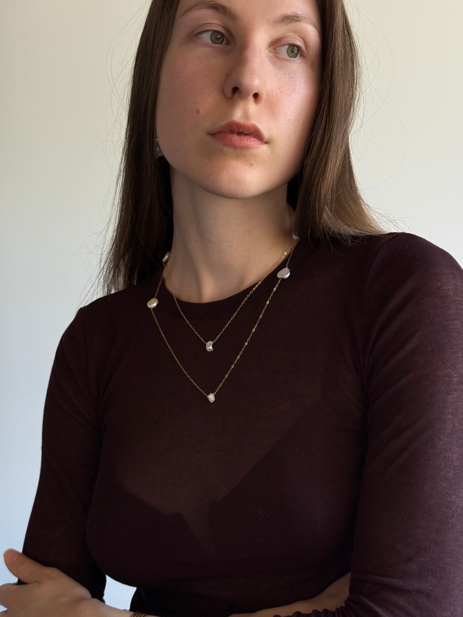 Styling video showing three ways to wear a long gold-filled pearl necklace