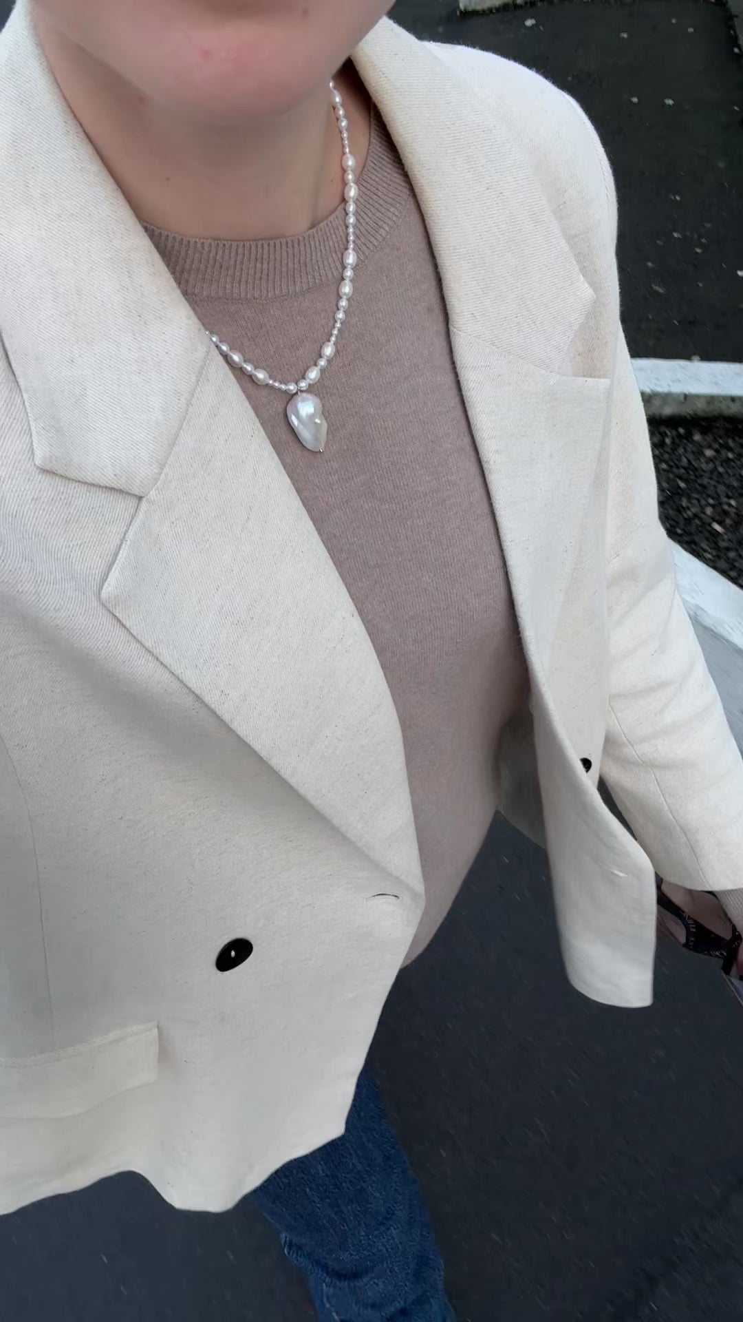 A graduated freshwater pearl necklace with a sculptural baroque pendant. 14k gold-filled findings, made to order in Wellington, New Zealand.